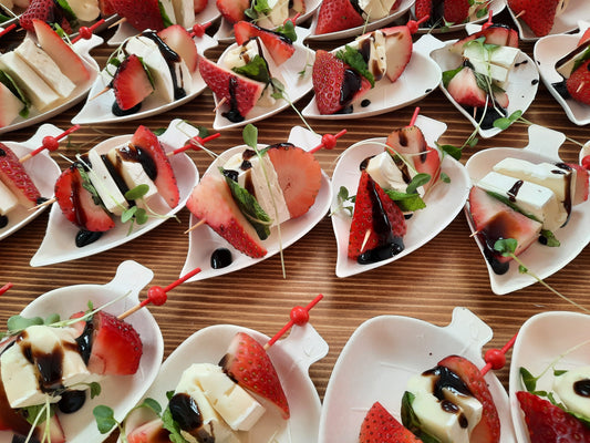 Cold appetizers | Strawberry, brie, basil and reduction on a skewer